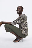 DRAPED ANIMAL PRINT BLOUSE